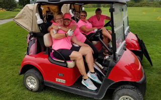 golfers on golf cart